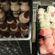 Crates of chocolate, regular, and strawberry milk in a high school cafeteria